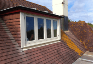 Exterior view of a dormer loft conversion on a tiled pitched roof