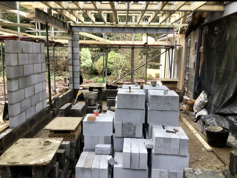 Rear of a house mid-extension, blockwork up and the opening formed