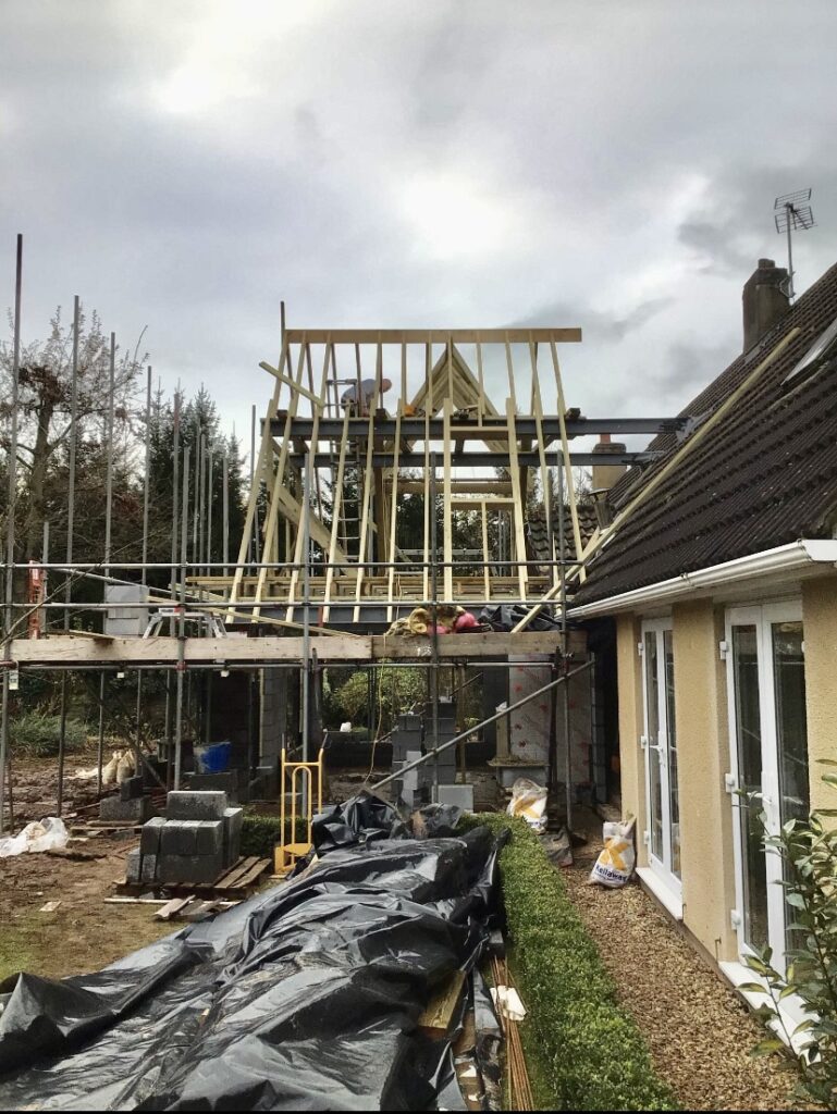 New timber frame erected alongside an existing bungalow