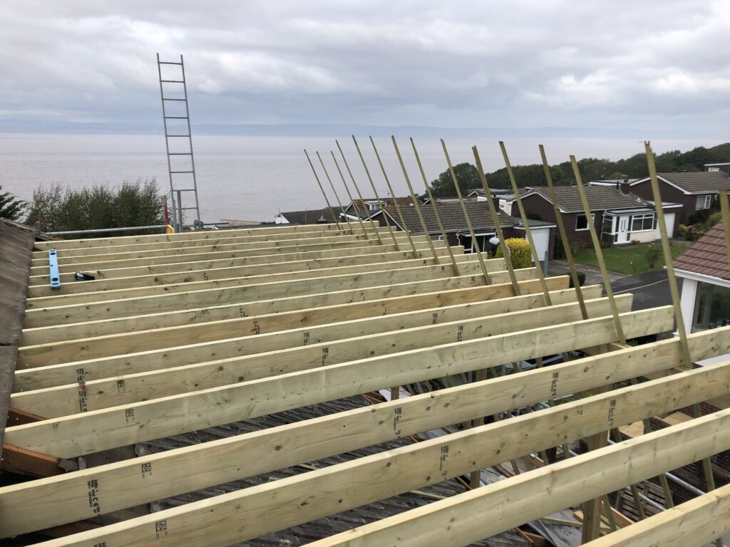 New floor joists spanning a property during a second-storey addition