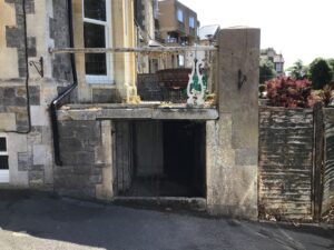 Period stone property before work, showing the original lower-ground level and retaining wall