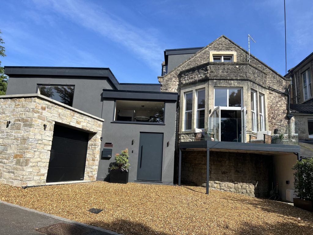 Stone house with a contemporary extension and integral garage