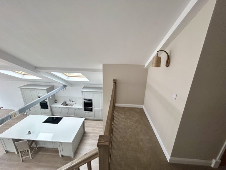 Landing with a rooflight and a study area under the eaves