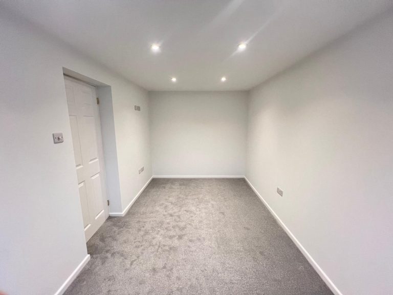 Finished lower-ground room, plastered and carpeted, ready for use