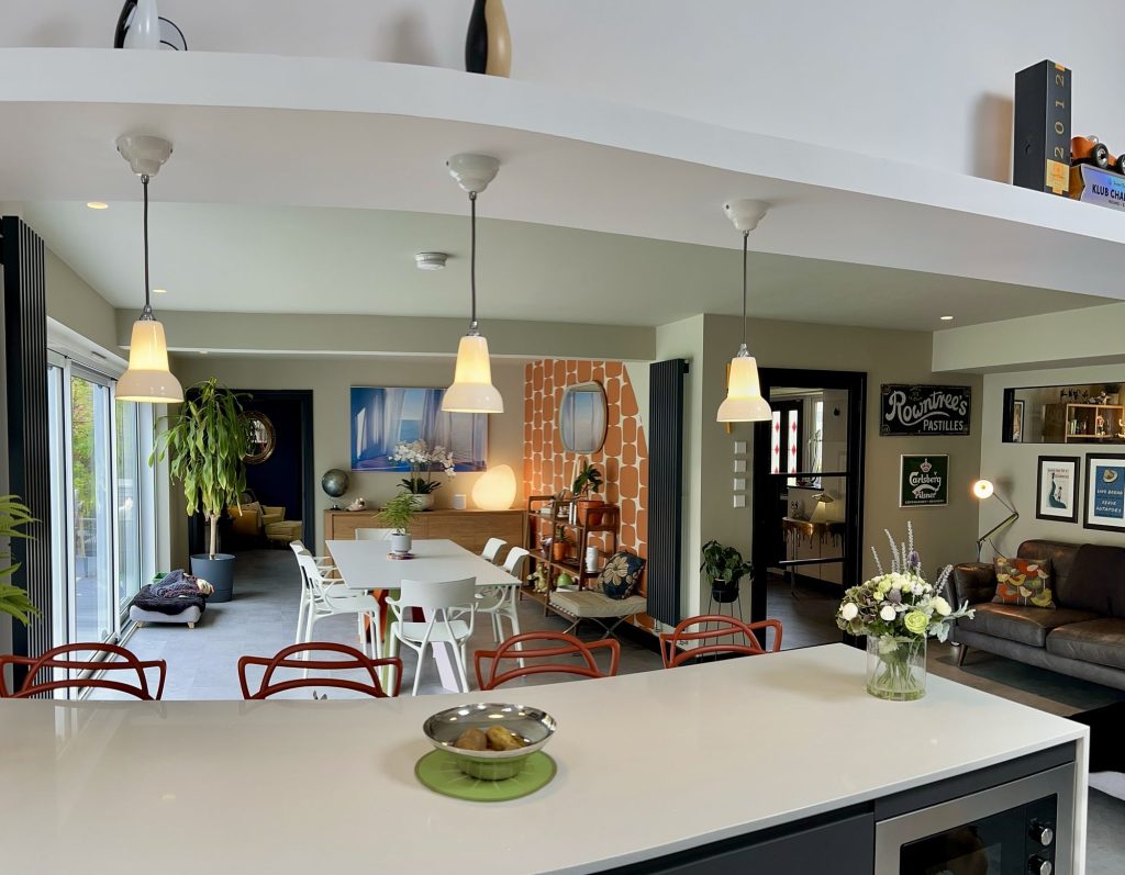 Open-plan kitchen and dining room with pendant lights and a large island