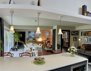 Open-plan kitchen and dining room with pendant lights and a large island