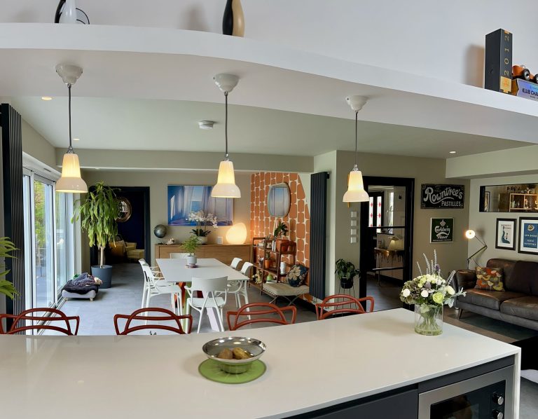 Open-plan kitchen and dining room with pendant lights and a large island