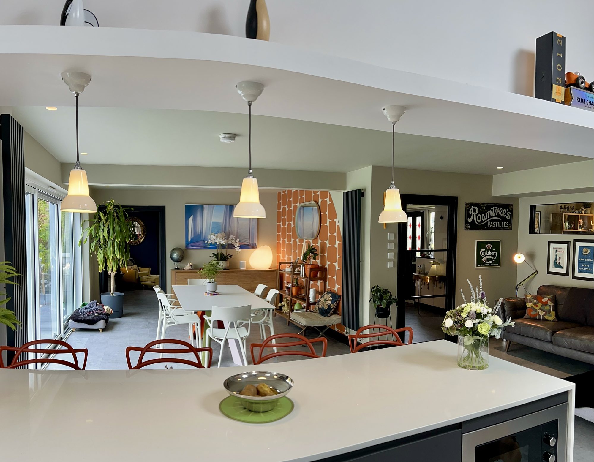 Open-plan kitchen and dining room with pendant lights and a large island
