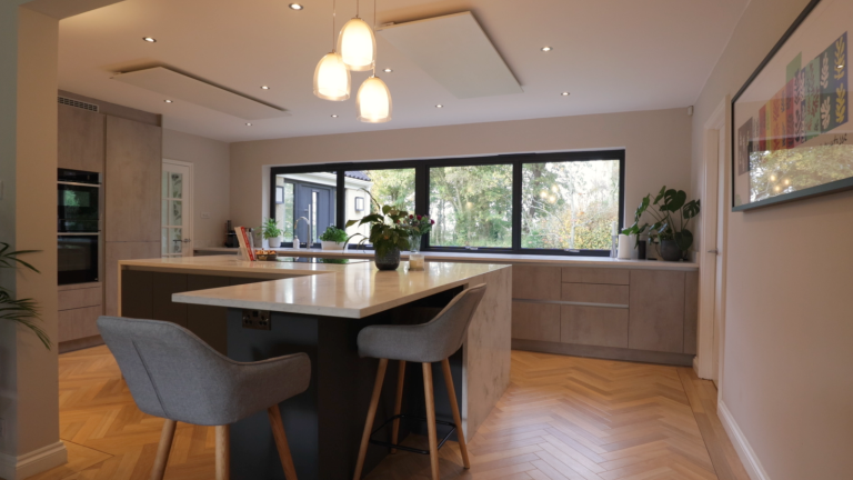 Kitchen and dining area with pendant lighting and a garden outlook